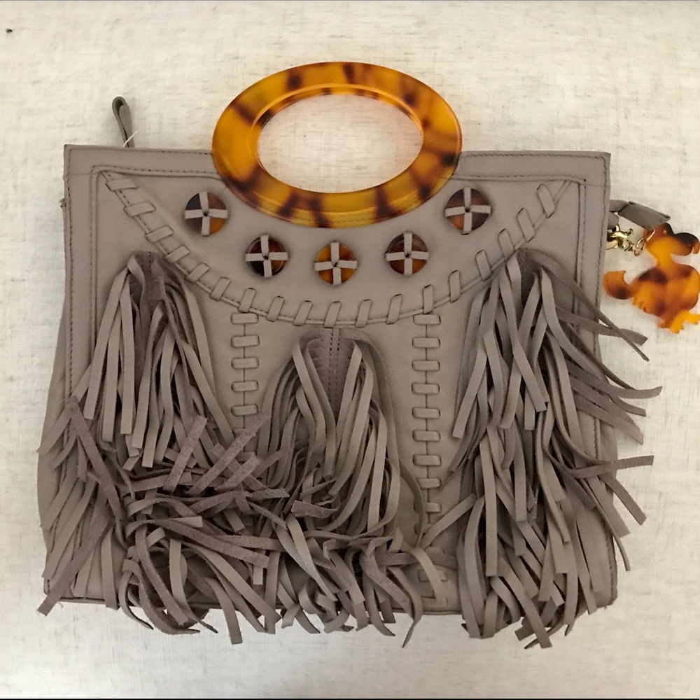 Grey leather satchel with tortoiseshell handle.